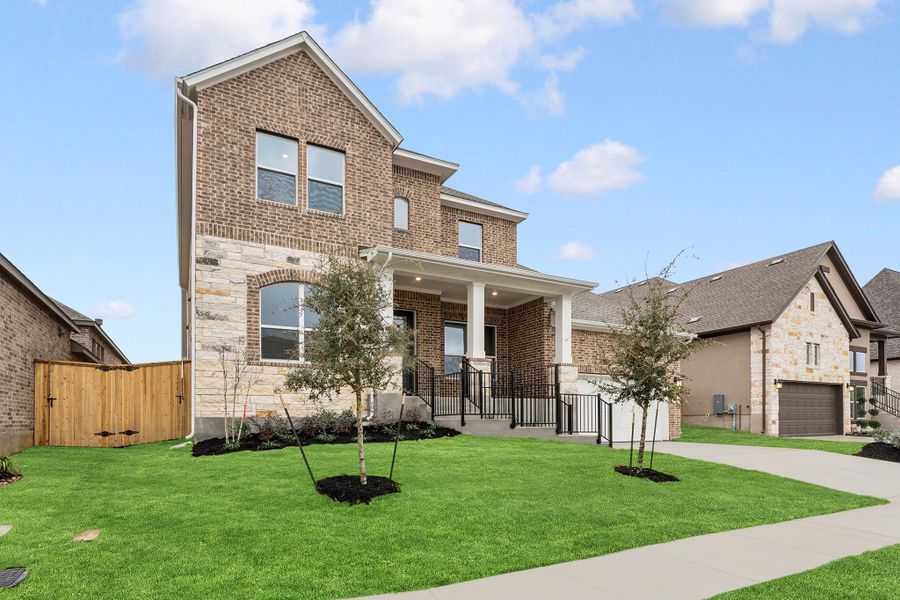 Front exterior of a new home in La Cima, San Marcos, TX, highlighting curb appeal (Image 22).