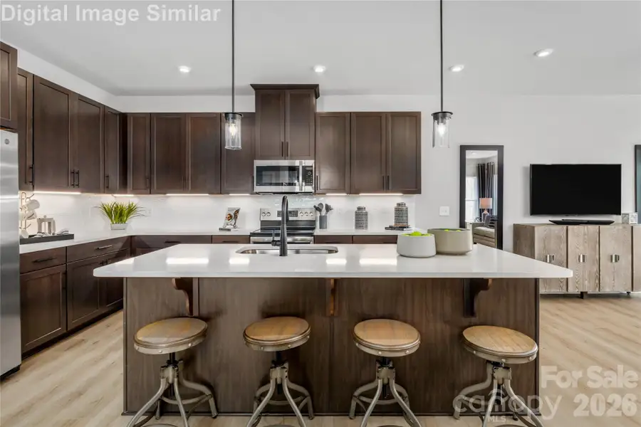 Step Into A Space Where Culinary Creativity Meets Effortless Hosting.  This Kitchen Wasn't Just Built For Cooking - It Was Designed To Be The Heart Of the Party.