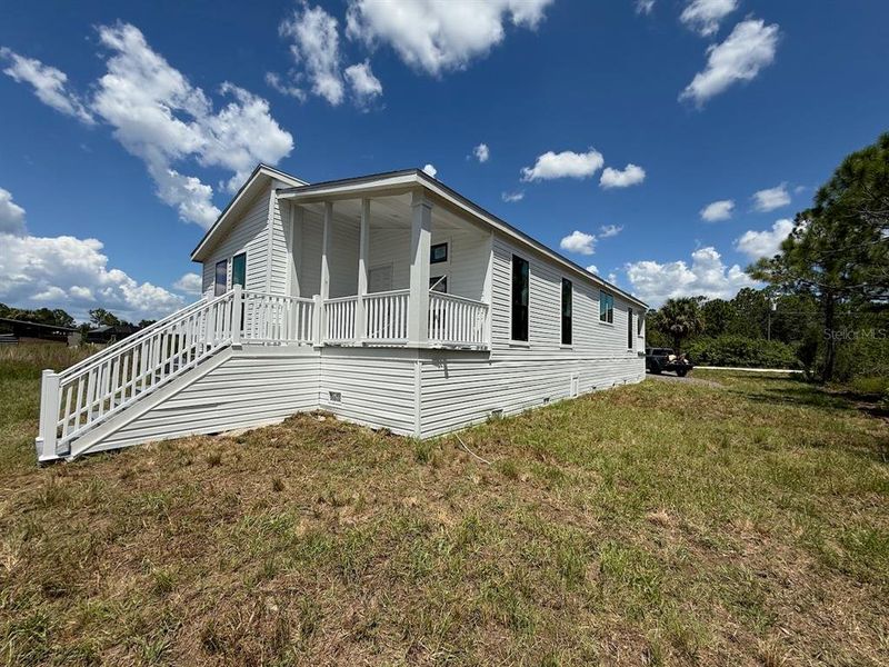 Front exterior of a new home in , Punta Gorda, FL, highlighting curb appeal (Image 32). Front exterior of a new home in , Punta Gorda, FL, highlighting curb appeal (Image 32).