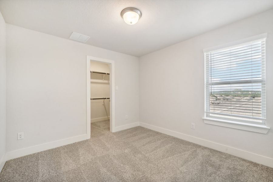 Guest bedroom in the Medina floorplan at a Meritage Homes community.