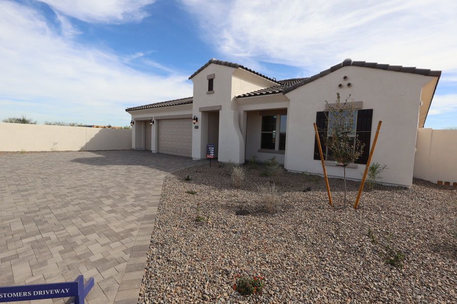 Exterior details and patio area of a home in Sentiero at Windrose, Waddell (Image 13).