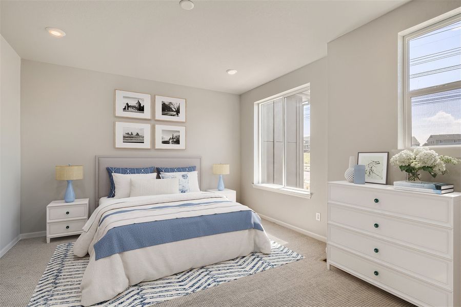 A bedroom with a bed and a dresser. A bedroom with a bed and a dresser.