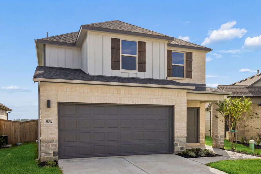 Front exterior of a new home in Riviera Pines, Huffman, TX, highlighting curb appeal (Image 2). Front exterior of a new home in Riviera Pines, Huffman, TX, highlighting curb appeal (Image 2).