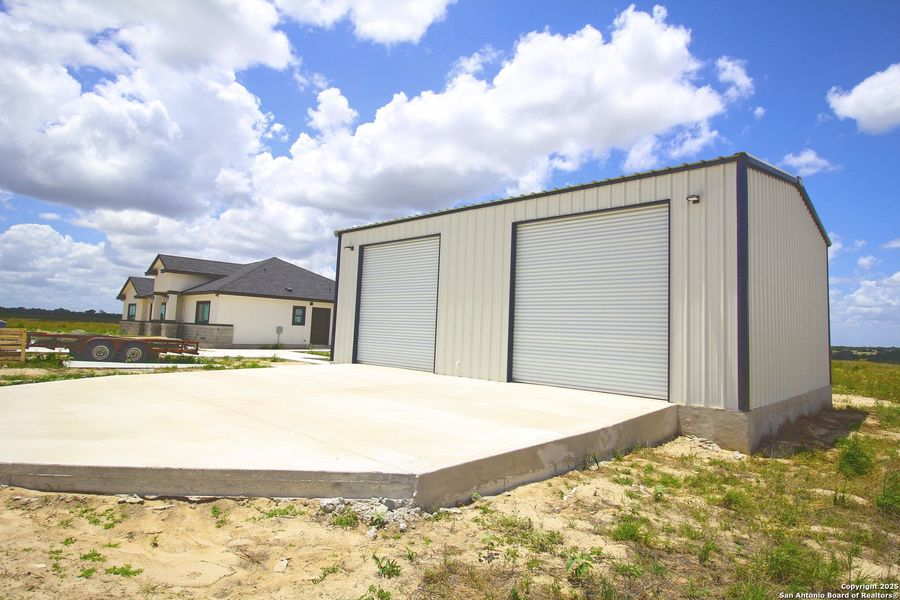 Front exterior of a new home in , La Vernia, TX, highlighting curb appeal (Image 19).