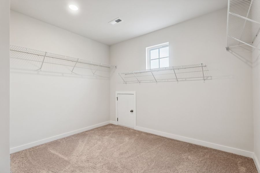 A room with a door and a window.