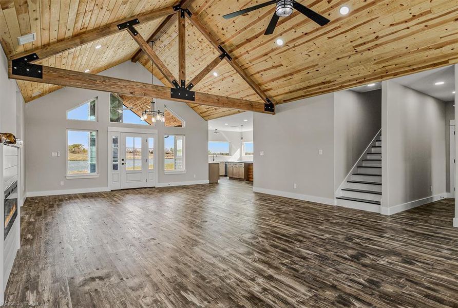 Open living and dining with cedar ceilings, gable. Electric Fireplace. LVP Floors throughout home.