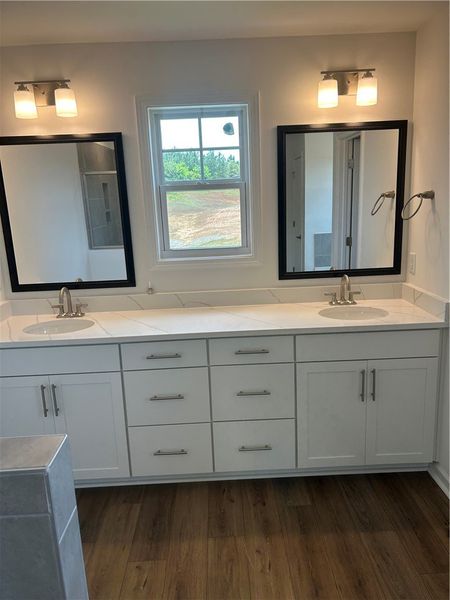 Dual vanity sinks provide ample space in this well