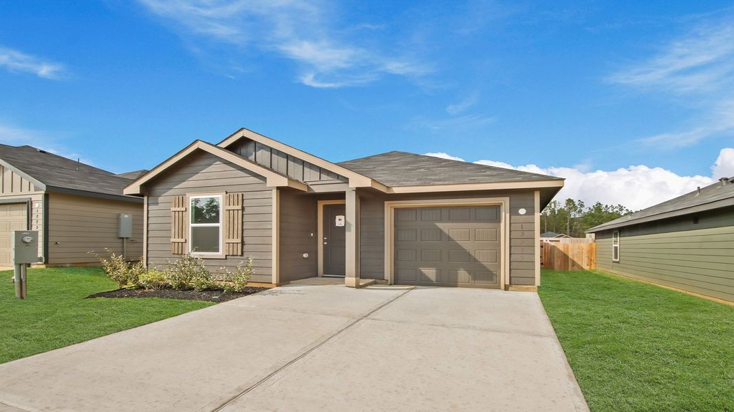 Front exterior of a new home in McCrorey Trails, Conroe, TX, highlighting curb appeal (Image 16).