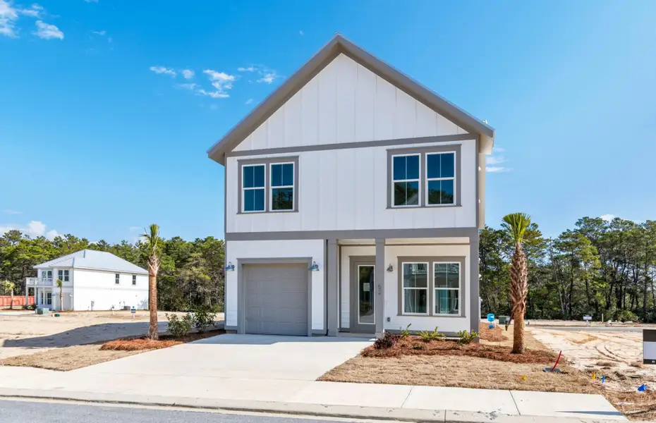 Front exterior of a new home in Nautilus Pointe, Inlet Beach, FL, highlighting curb appeal (Image 2). Front exterior of a new home in Nautilus Pointe, Inlet Beach, FL, highlighting curb appeal (Image 2).
