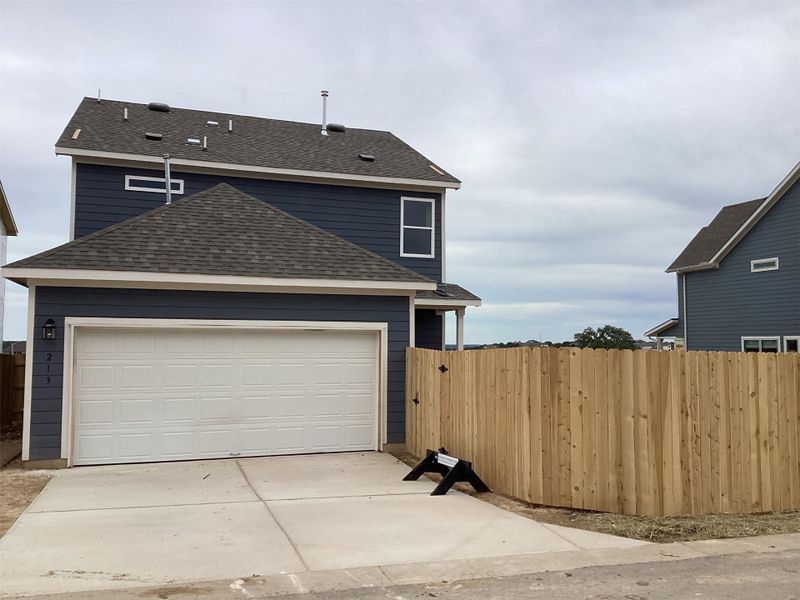 Front exterior of a new home in Lariat, Liberty Hill, TX, highlighting curb appeal (Image 1). Front exterior of a new home in Lariat, Liberty Hill, TX, highlighting curb appeal (Image 1).