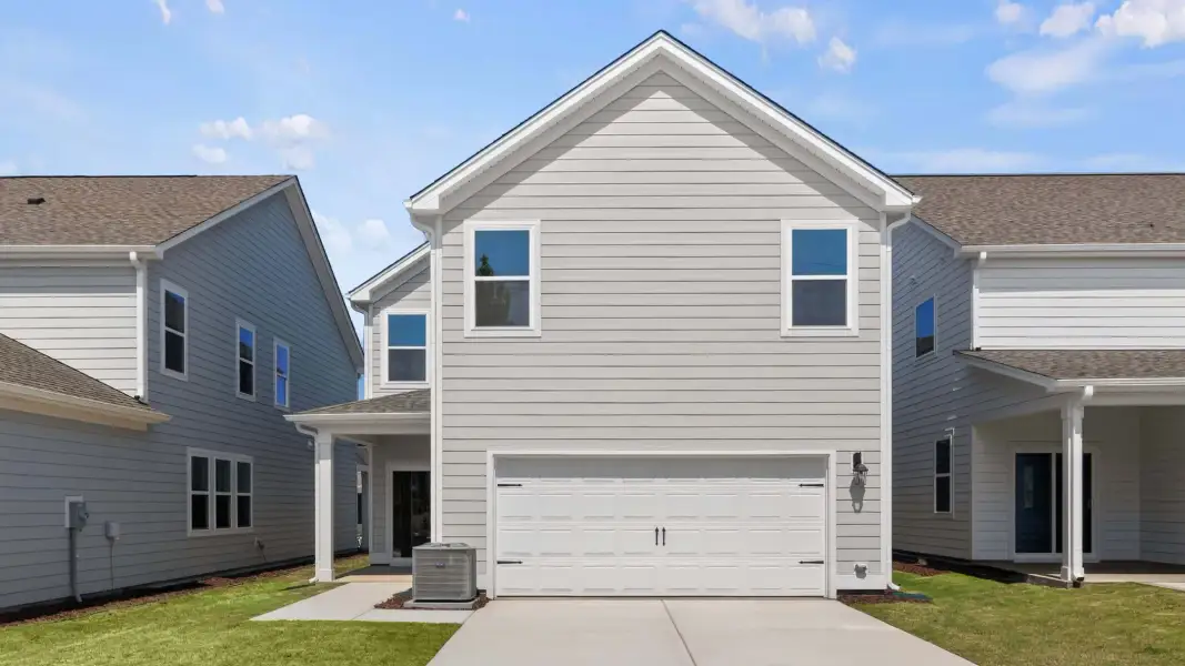 Front exterior of a new home in Madden West, Fuquay Varina, NC, highlighting curb appeal (Image 17).