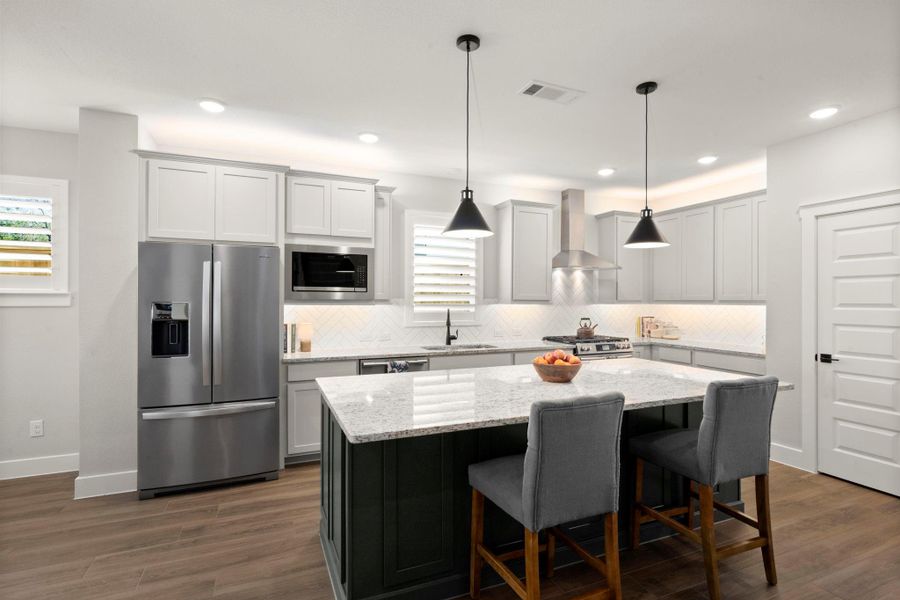 Sleek appliances enhance the kitchen’s modern, streamlined feel Sleek appliances enhance the kitchen’s modern, streamlined feel