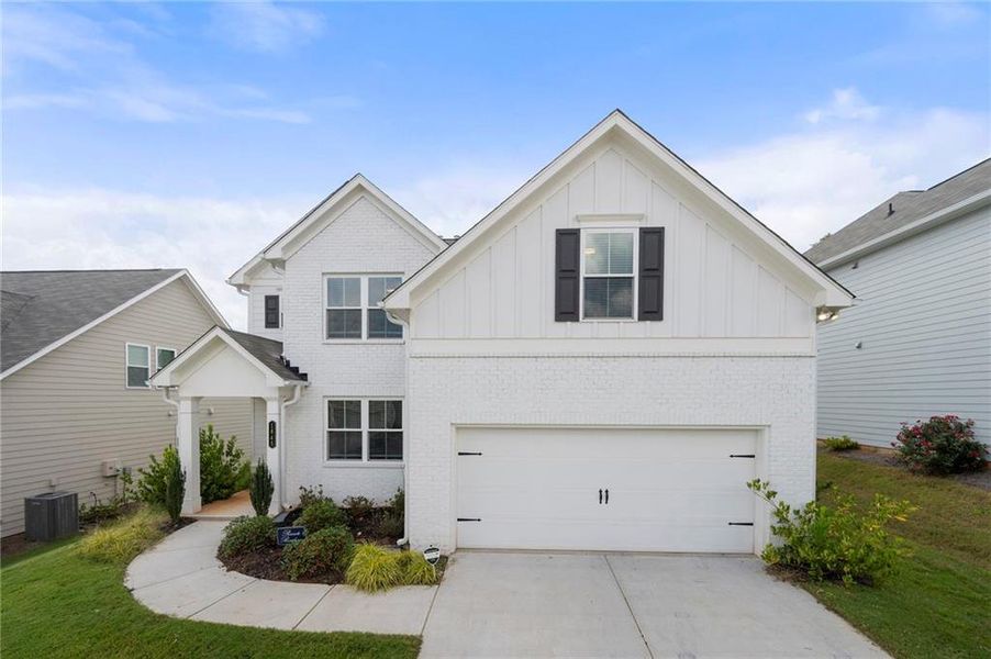 Front exterior of a new home in Avenbrook, Mableton, GA, highlighting curb appeal (Image 2).