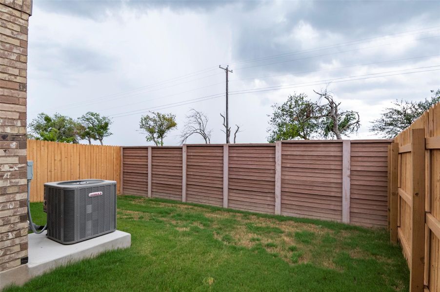 Front exterior of a new home in Saddle Creek Twinhomes, Georgetown, TX, highlighting curb appeal (Image 23). Front exterior of a new home in Saddle Creek Twinhomes, Georgetown, TX, highlighting curb appeal (Image 23).