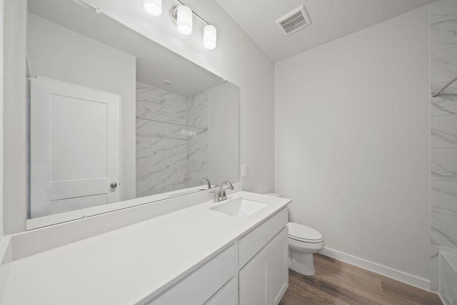 Furnished interior view inside a new home in Sunterra, Katy (Image 7).