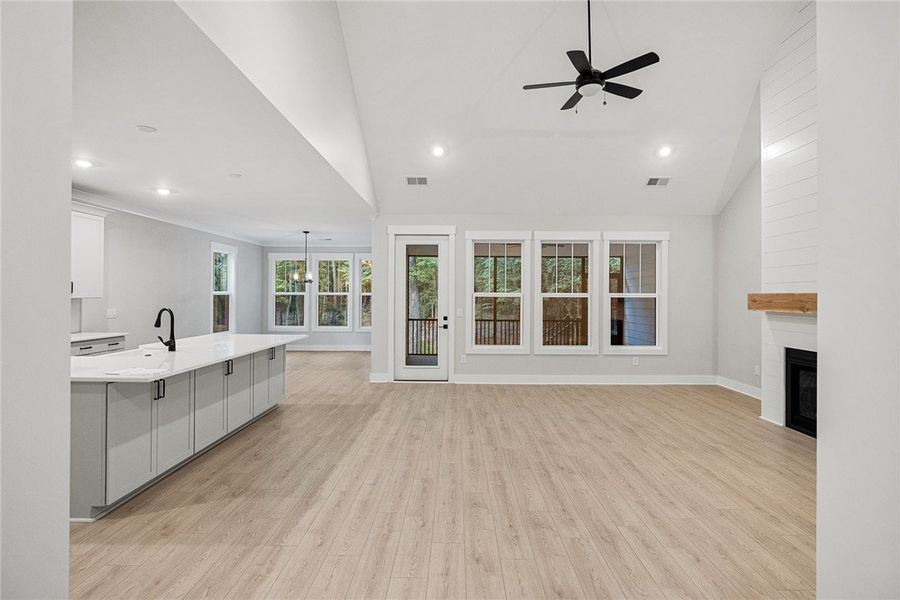 An open-concept living space features vaulted ceil An open-concept living space features vaulted ceil