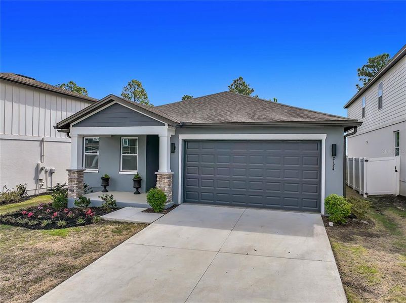 Front exterior of a new home in , Clermont, FL, highlighting curb appeal (Image 26).