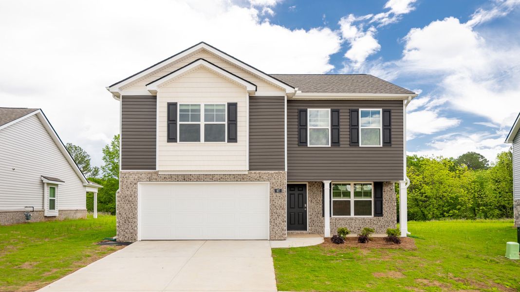 Front exterior of a new home in Price's Crossing, LaFayette, GA, highlighting curb appeal (Image 1).