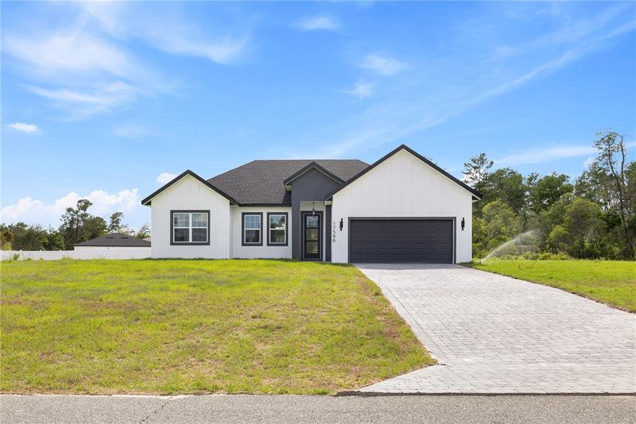 Front exterior of a new home in , Ocala, FL, highlighting curb appeal (Image 1). Front exterior of a new home in , Ocala, FL, highlighting curb appeal (Image 1).