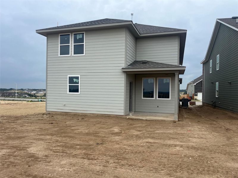 Front exterior of a new home in The Homestead at Lariat, Liberty Hill, TX, highlighting curb appeal (Image 12). Front exterior of a new home in The Homestead at Lariat, Liberty Hill, TX, highlighting curb appeal (Image 12).