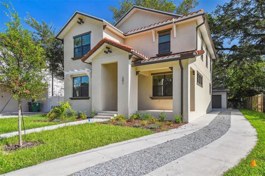 Front exterior of a new home in , St. Petersburg, FL, highlighting curb appeal (Image 1). Front exterior of a new home in , St. Petersburg, FL, highlighting curb appeal (Image 1).