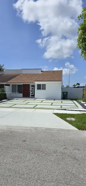 Front exterior of a new home in , Miami, FL, highlighting curb appeal (Image 1). Front exterior of a new home in , Miami, FL, highlighting curb appeal (Image 1).