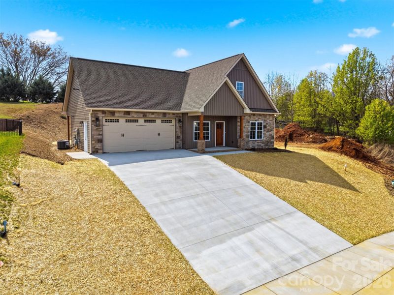 Front exterior of a new home in , Hickory, NC, highlighting curb appeal (Image 1). Front exterior of a new home in , Hickory, NC, highlighting curb appeal (Image 1).