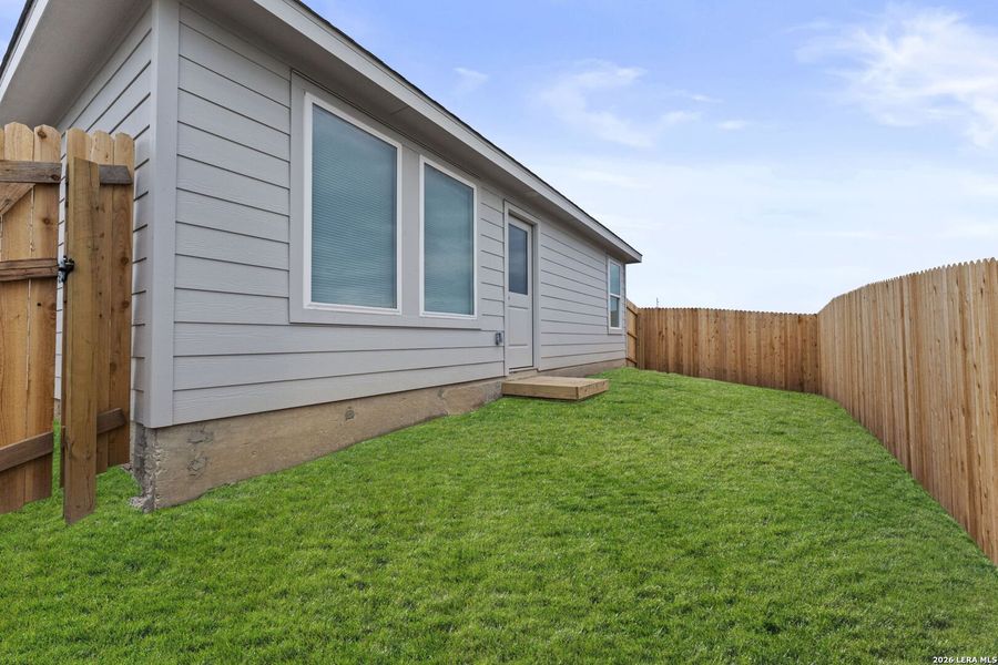 Exterior details and patio area of a home in Guadalupe Ridge, New Braunfels (Image 2).