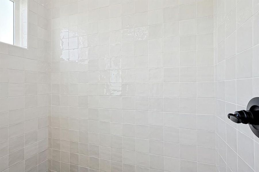 Primary Bathroom details featuring a tile shower