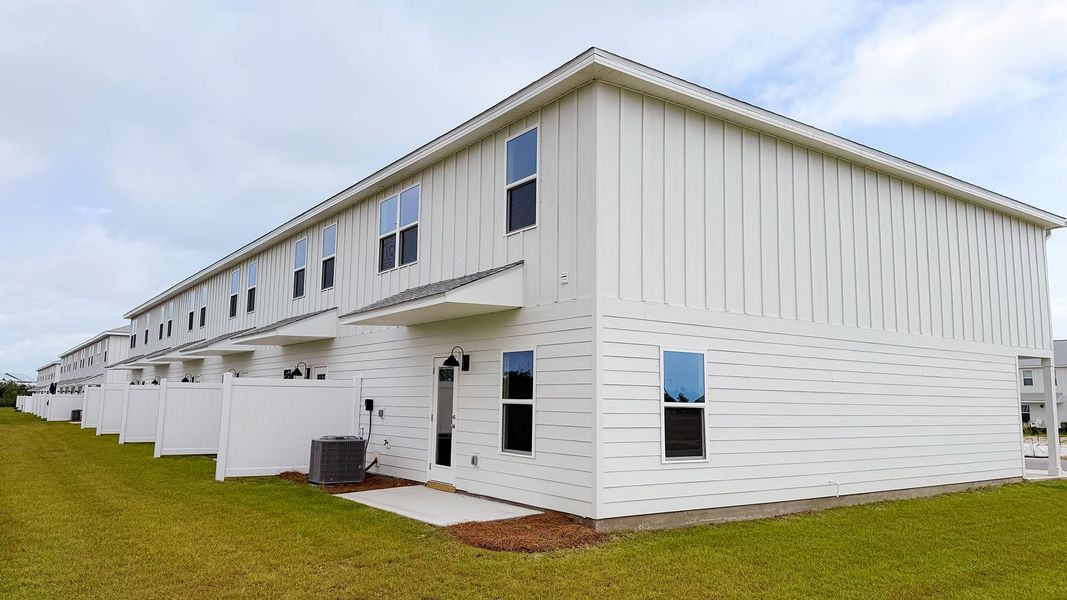Exterior details and patio area of a home in Salt Creek Townhomes at Mexico Beach, Mexico Beach (Image 3).