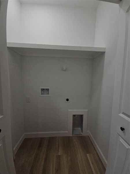 Clothes washing area with baseboards, dark wood finished floors, washer hookup, laundry area, and hookup for an electric dryer