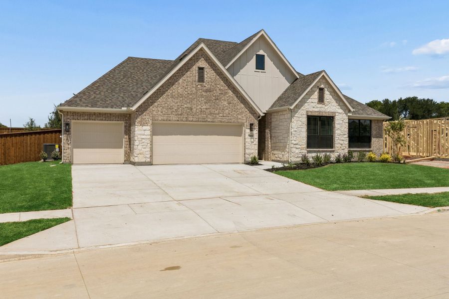 Front exterior of a new home in Rainwater Crossing, Celina, TX, highlighting curb appeal (Image 2). Front exterior of a new home in Rainwater Crossing, Celina, TX, highlighting curb appeal (Image 2).
