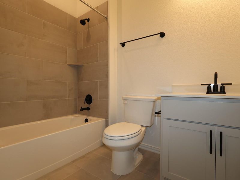 Furnished interior view inside a new home in Heritage, Dripping Springs (Image 8).