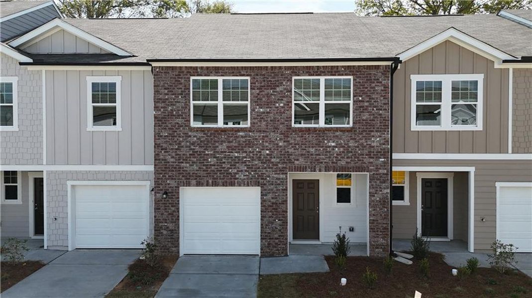Front exterior of a new home in Kingston Cove, Auburn, GA, highlighting curb appeal (Image 2). Front exterior of a new home in Kingston Cove, Auburn, GA, highlighting curb appeal (Image 2).