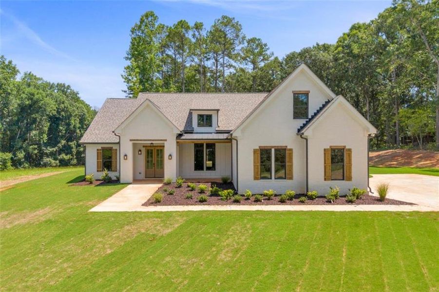 Front exterior of a new home in , Monroe, GA, highlighting curb appeal (Image 27). Front exterior of a new home in , Monroe, GA, highlighting curb appeal (Image 27).