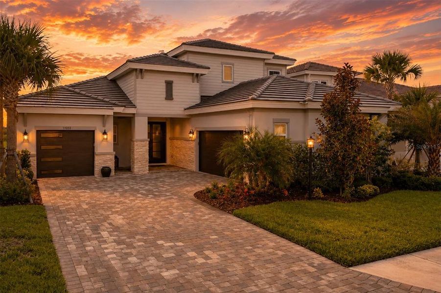 Front exterior of a new home in Star Farms at Lakewood Ranch, Lakewood Ranch, FL, highlighting curb appeal (Image 20). Front exterior of a new home in Star Farms at Lakewood Ranch, Lakewood Ranch, FL, highlighting curb appeal (Image 20).