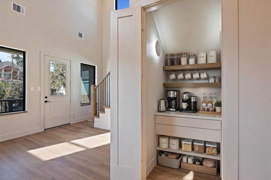 Walk-in panty, with custom storage and electrical outlets. Perfect for a coffee bar or to hide away countertop appliances Walk-in panty, with custom storage and electrical outlets. Perfect for a coffee bar or to hide away countertop appliances