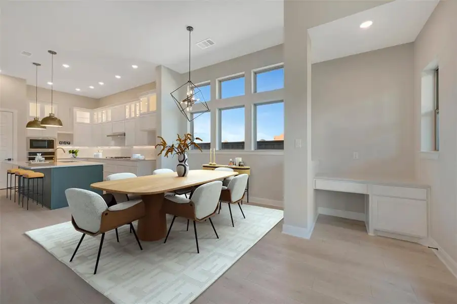 Dining area featuring light wood-style floors and recessed lighting Dining area featuring light wood-style floors and recessed lighting