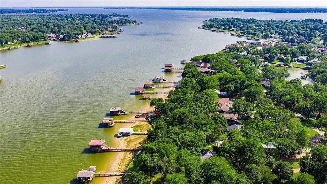 Expansive lakefront properties featuring private boat docks and treed lots Expansive lakefront properties featuring private boat docks and treed lots
