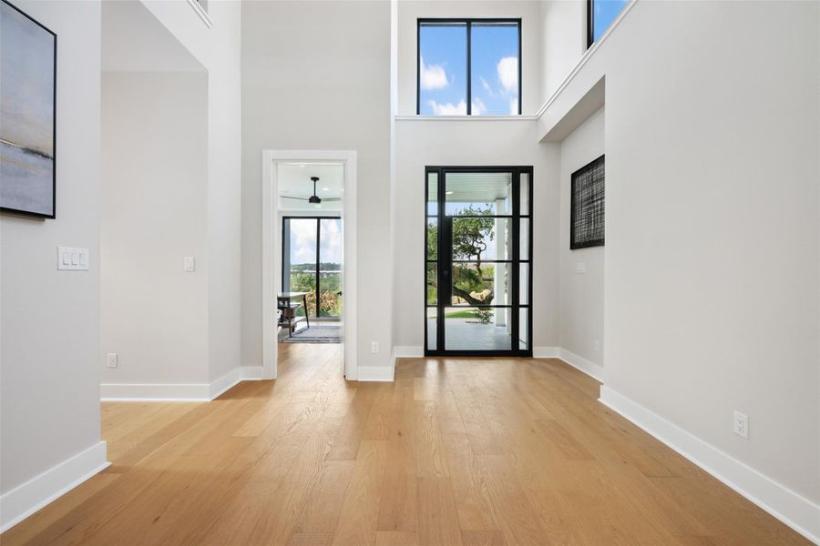 White Oak Flooring and Iron and Glass door welcome you in. White Oak Flooring and Iron and Glass door welcome you in.