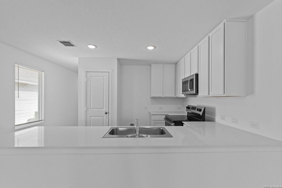 Furnished interior view inside a new home in Higdon Crossing, San Antonio (Image 8).