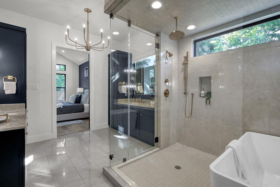 Spa-like ensuite bathroom with modern fixtures and abundant natural light. Spa-like ensuite bathroom with modern fixtures and abundant natural light.