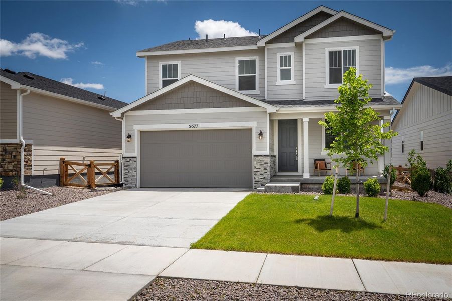 Front exterior of a new home in , Colorado Springs, CO, highlighting curb appeal (Image 18).