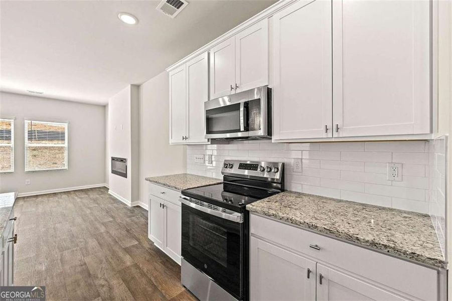 Furnished interior view inside a new home in The Grove At Mundy Mill, Gainesville (Image 8).
