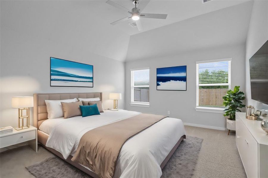 What a wonderful place to come home to, this stunning master suite greets you with plush carpet flooring, a warm custom paint, high ceiling, lighting, large windows with blinds allowing in natural light brightening up this spacious master bedroom.