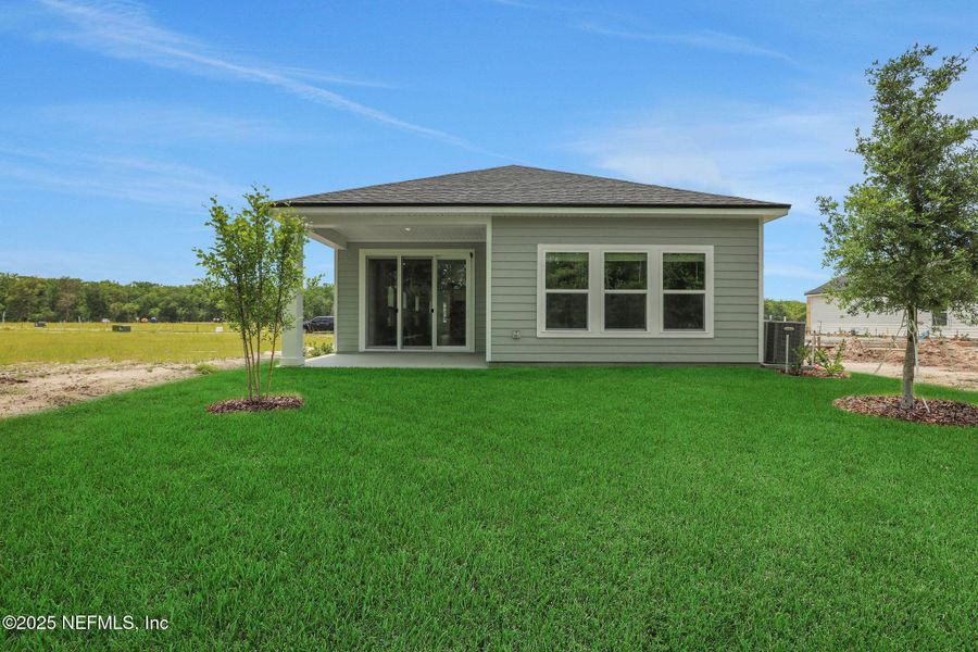 Front exterior of a new home in TrailMark, St. Augustine, FL, highlighting curb appeal (Image 19). Front exterior of a new home in TrailMark, St. Augustine, FL, highlighting curb appeal (Image 19).