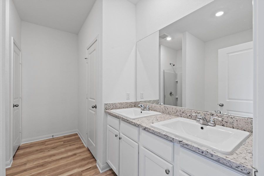 Inside the master bath, you’ll love the double-sink vanity, large soaker tub, separate shower and the huge walk-in closet