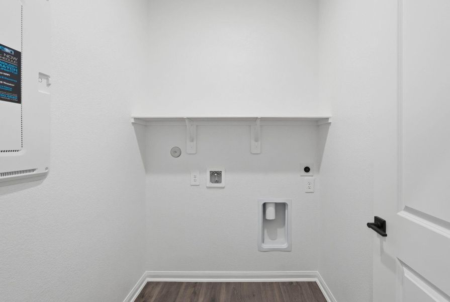 Simple and practical, this laundry space keeps everything organized with clean finishes and smart storage.