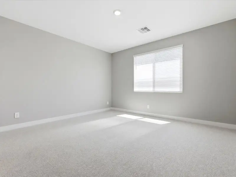 Spacious, unfurnished interior of a new home in Blossom Rock Reserve Series, Apache Junction (Image 16).