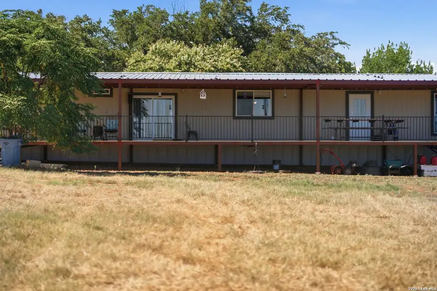 Exterior details and patio area of a home in , Devine (Image 23).